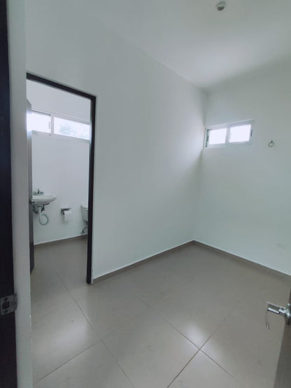 un baño con un lavamanos en residencial playa magna playa del carmen
