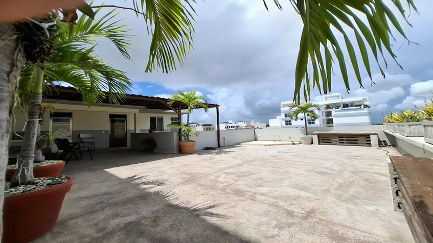 una terraza compartida en siena suites playa del carmen