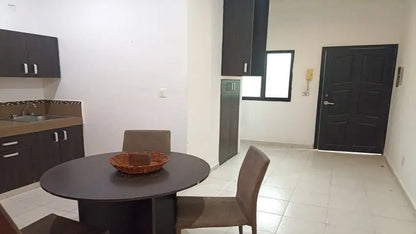 una sala comedor en xharm condo playa del carmen