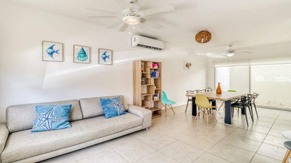 una sala comedor en residencial lunamar playa del carmen