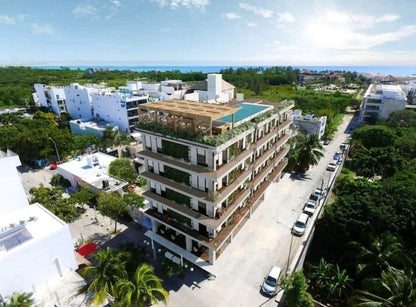 una vista aerea de un edificio en macondo 5ta avenida playa del carmen