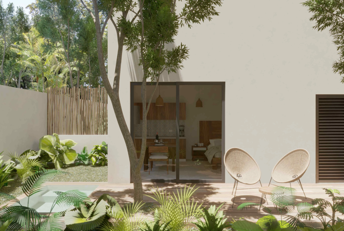 una terraza con jardin y sillas de espera en muwan tulum
