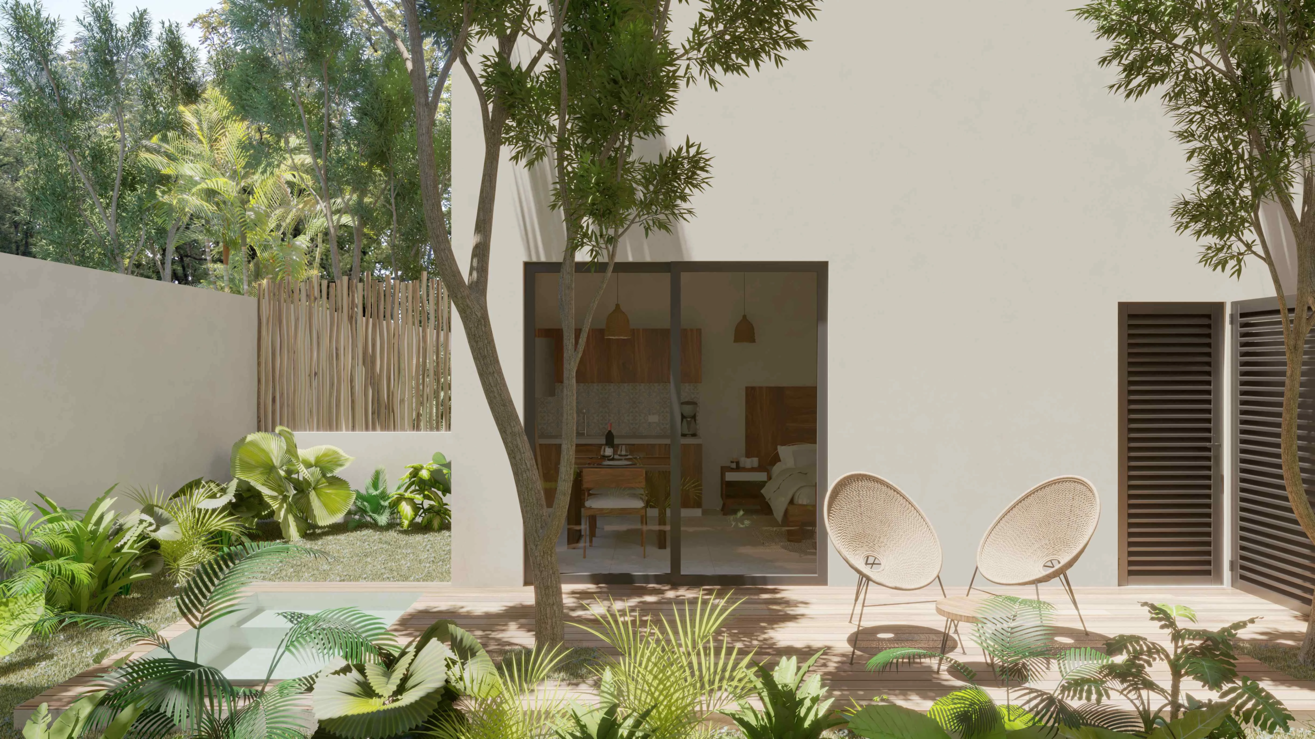 una terraza con jardin y sillas de espera en muwan tulum