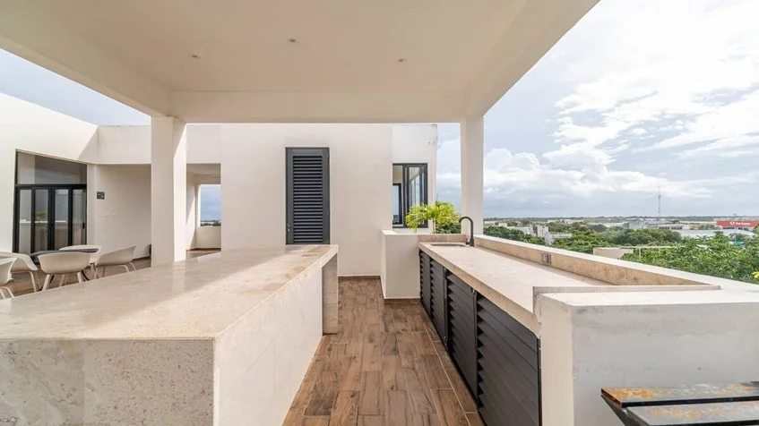 un area de asadores con un lavamanos en mya black diamond playa del carmen