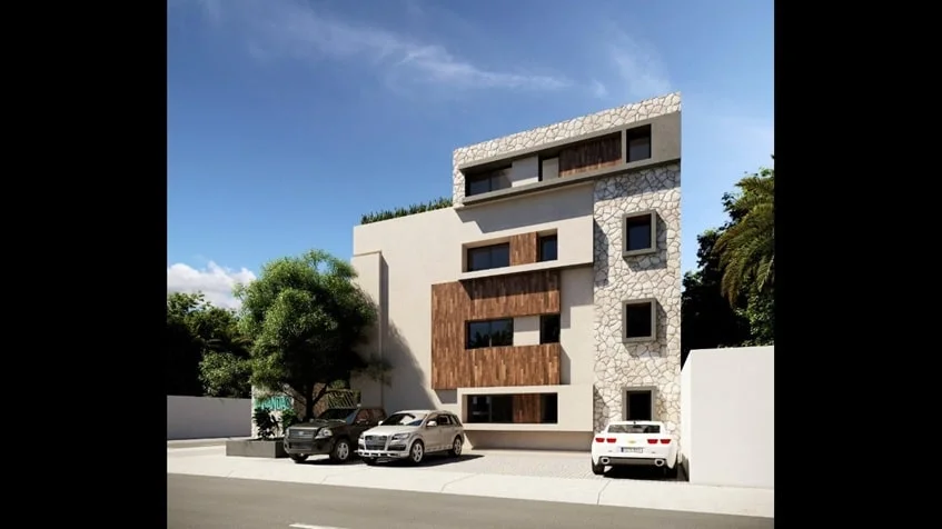 una fachada de un edificio con un estacionamiento en verandas condos playa del carmen