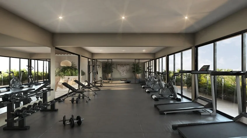 un gimnasio con vista a la ciudad en studio 34 playa del carmen