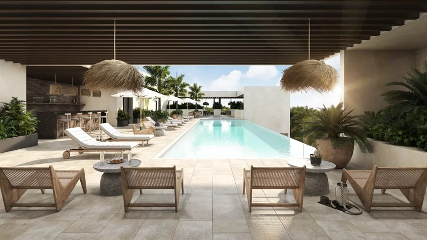 una piscina con camastros en studio 34 playa del carmen