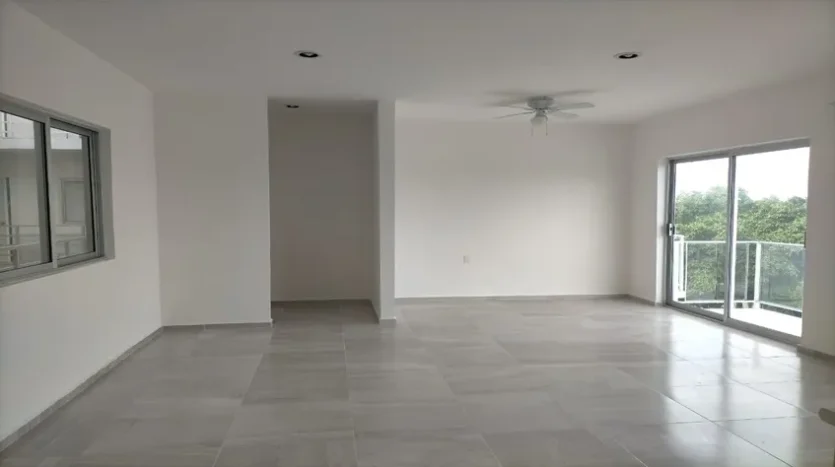 un area de sala y comedor en condo jim ejidal playa del carmen