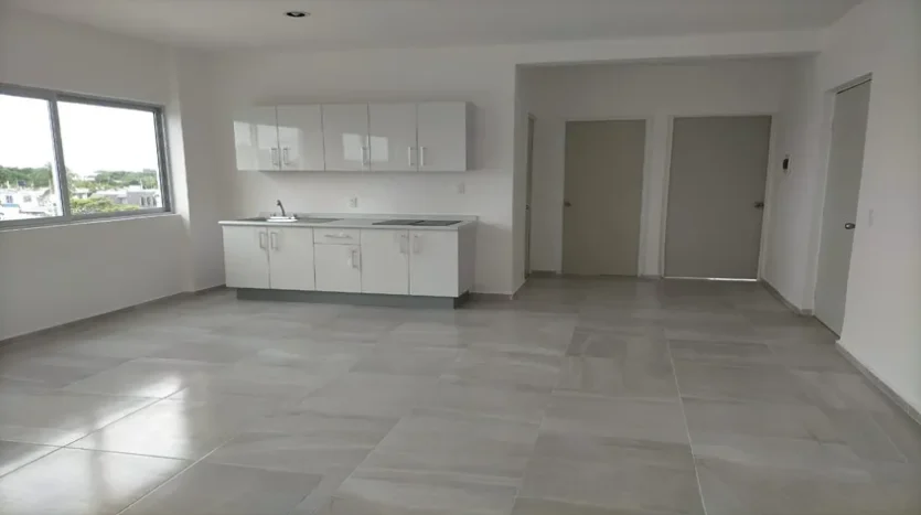 una sala y un comedor amplios en condo jim ejidal playa del carmen